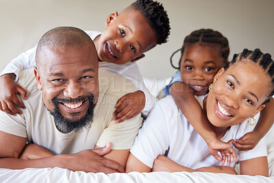 Buy stock photo Portrait, black family and children in bedroom for bonding, together for happiness in home on weekend. Woman, man and kids with hug, love and affection for memory, growth and development as parents