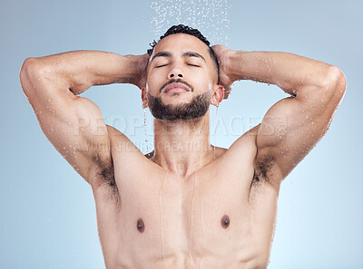 Buy stock photo Shower, relax and man with skincare, grooming and fresh morning bathroom routine on blue background. Health, wellness and male person in water for cleaning, washing and hair care hygiene in studio.