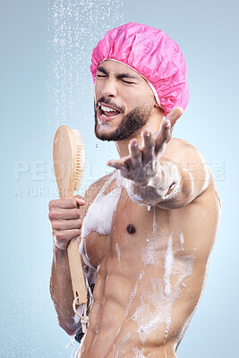 Buy stock photo Shower cap, singing and man with brush for grooming, skincare and morning routine on blue background. Health, wellness and happy male person in water for cleaning, grooming and hygiene in studio