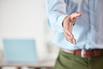 Closeup of one business man extending hand forward to greet and welcome with handshake. Networking and meeting for interview to agree on deal or offer. Collaborating on negotiation for job promotion