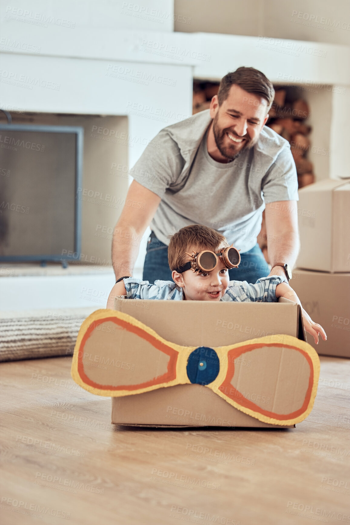 Buy stock photo Father, kids and home with cardboard airplane for playing, happiness and bonding in new family house. Dad, siblings and push box in living room for fun or energy, growth and development with children