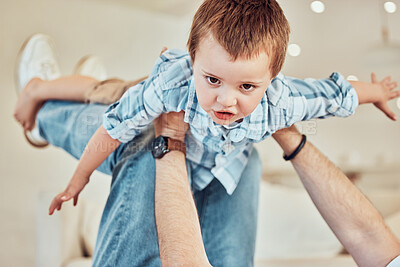 Buy stock photo Father, boy and flying portrait in home, support and balance or lifting in air or play superhero. Daddy, son and arms for airplane game or bonding together on weekend, freedom and love in childhood