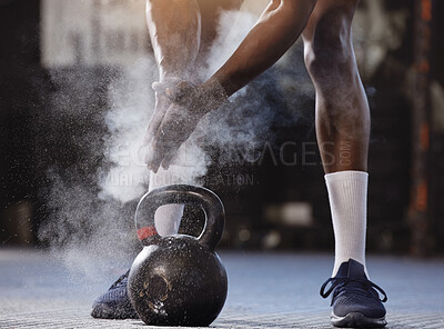 Buy stock photo Powder, hands and kettlebell exercise with a man at gym for fitness, training and strong muscle. Athlete or bodybuilder person start weights workout for power and performance with chalk at a club 