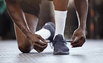 Buy stock photo Tie, fitness and hands on shoes at gym for workout, training or exercise or runner ready to start exercising. Black man, goals and tie running shoes in sports performance, health practice or class