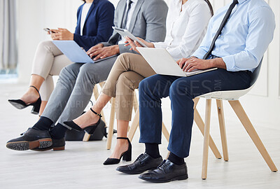 Buy stock photo Technology, recruitment and legs of business people waiting in queue for job interview process in office. Human resources, meeting and hiring candidates with phone, laptop and tablet for vacancy.