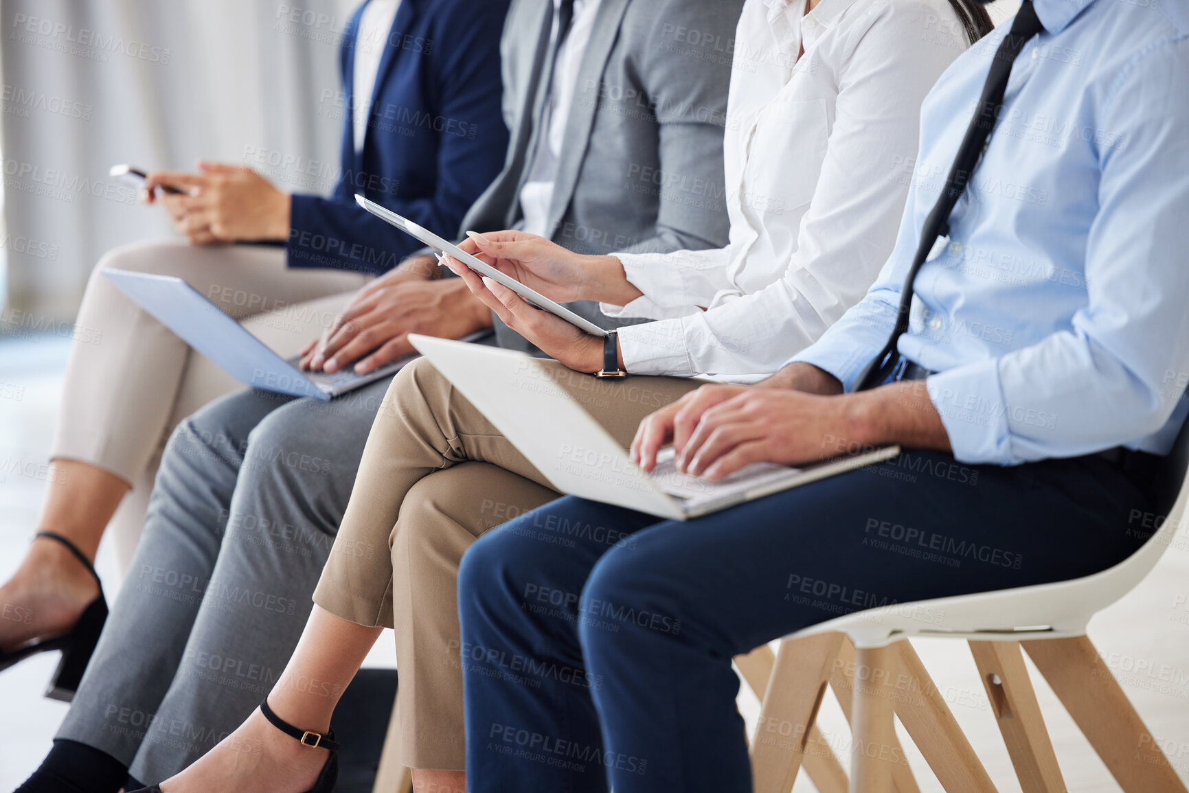 Buy stock photo Technology, recruitment and business people waiting in queue for job interview process in office. Human resources, meeting and group of hiring candidates with phone, laptop and tablet for vacancy.