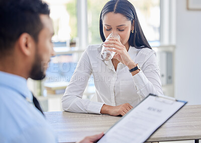 Buy stock photo Drinking, water and woman with job interview in office for legal vacancy with man hr manager. Nervous, clipboard and female lawyer hiring candidate with beverage for hydration in recruitment meeting.