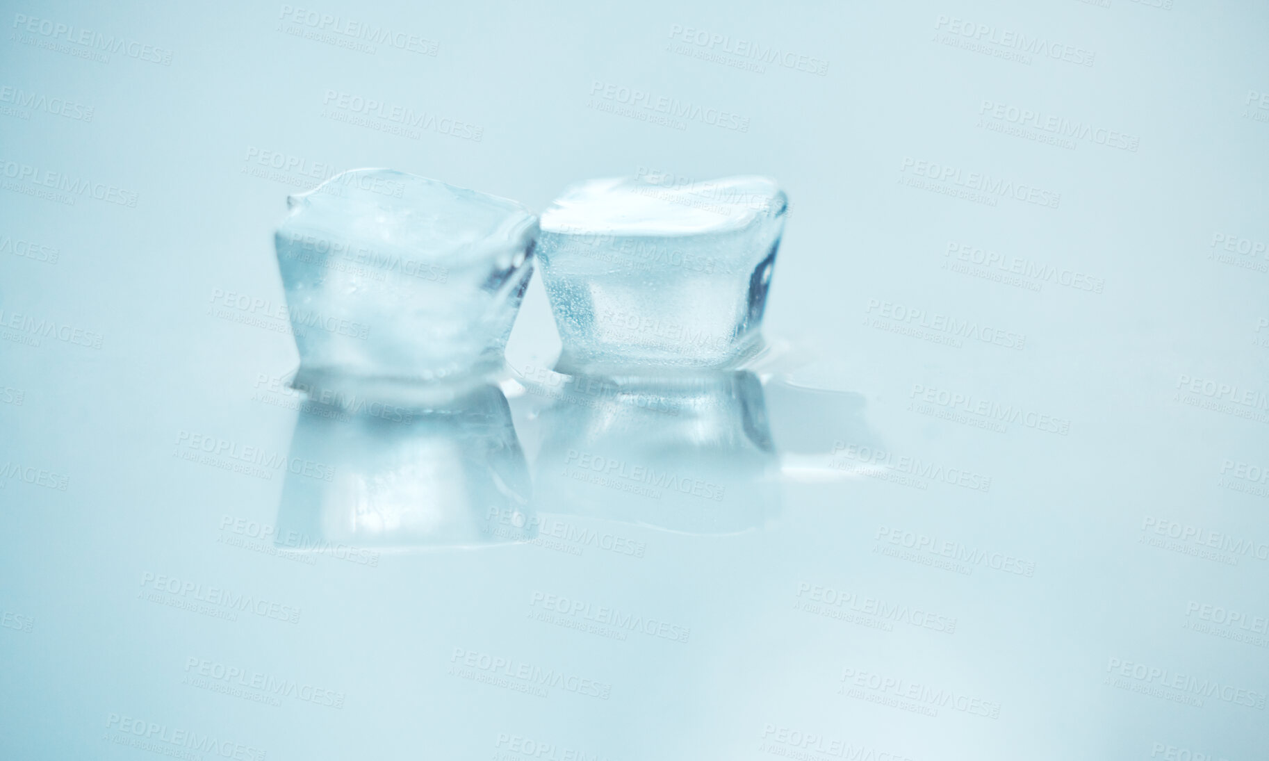 Buy stock photo Ice cube, melting and closeup for global warming by white background for reflection, greenhouse gasses or mockup. Frozen water, sustainability or icon for iceberg, glacier or climate change in nature