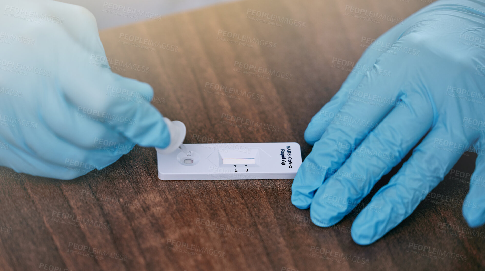 Buy stock photo Nurse, hand and rapid antigen or test for virus diagnosis, healthcare and fast results in hospital. Medical expert, fingers and screening kit for blood with healthy immune system, sick and self check