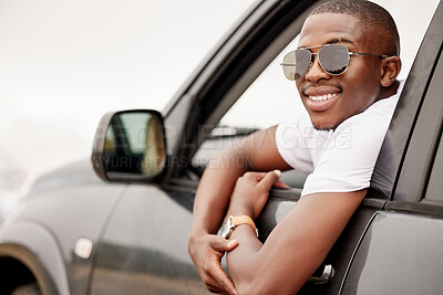 Buy stock photo Black man, window and portrait in car with journey for summer vacation, holiday and tourism in Kenya. Happy, drive and person with sunglasses in vehicle for outdoor adventure, road trip and travel