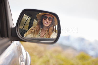 Buy stock photo Car, travel and woman with sunglasses by mirror for road trip, adventure and summer holiday. Happy, female person and smile with hat in vehicle for weekend drive, vacation and tourism in California