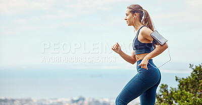 Buy stock photo Running, outdoor and woman with music, listening and armband for earphones, online and cellphone. Fitness, practice and jog for competition, cardio and workout for girl in sportswear and healthy