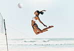 Sports woman jump at volleyball beach summer outdoor competition game on ocean or sea sand playing to win. Healthy, fitness and training agile girl or young athlete ready hit ball over net in match