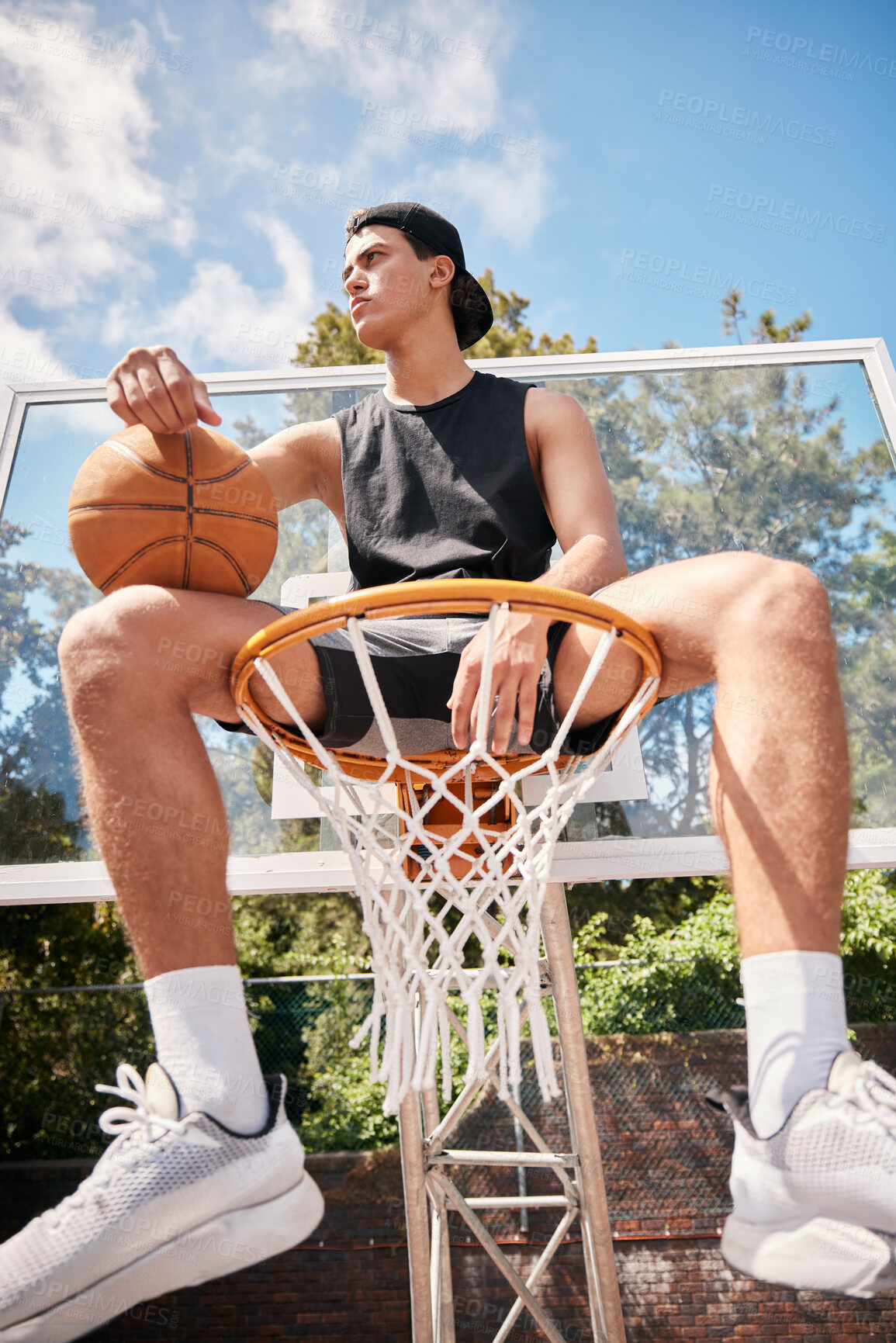 Buy stock photo Basketball, sports and man on basket with ball for fitness, exercise and training workout at a community park with sports sneakers. Basketball player, urban court and game with male athlete thinking