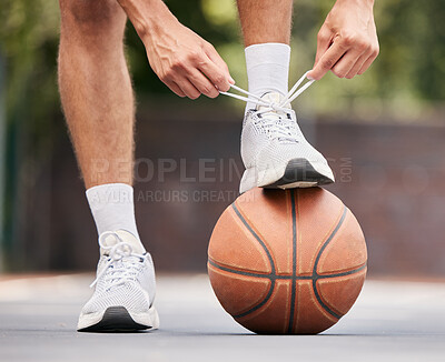 Buy stock photo Basketball, athlete with shoelace, shoes and sport on basketball court outdoor, fitness and exercise motivation. Man, basketball player and ready for game, training and active with cardio and sports.