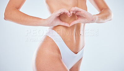 Buy stock photo Beauty, body and woman with heart hands in studio isolated on a gray background. Skincare health, underwear and aesthetic of slim female model with love sign for self love, body care and wellness.