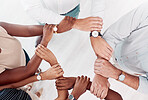 Top view, business people hands or holding wrists in collaboration, office workshop or solidarity for teamwork diversity, community or motivation. Men, women or creative support arms for target goals