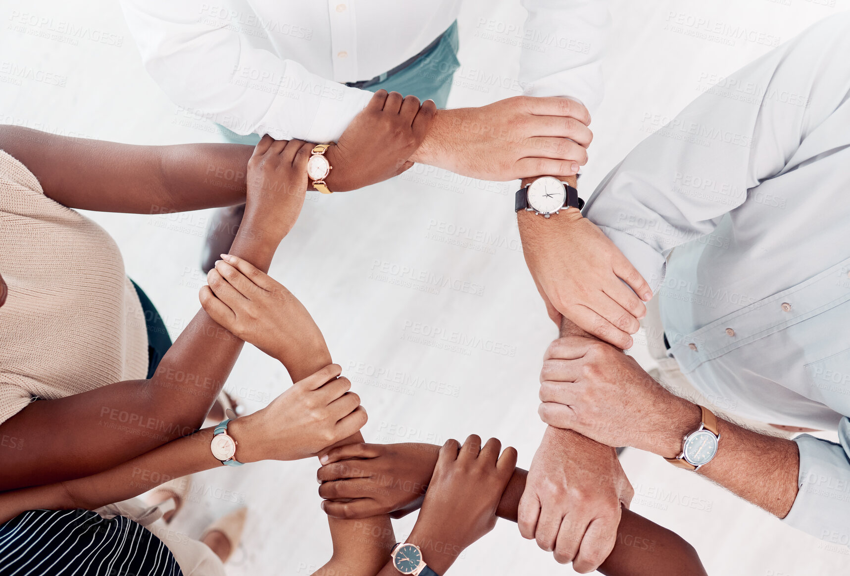 Buy stock photo Top view, business people hands or holding arm in collaboration, office workshop or solidarity for teamwork diversity, community or motivation. Men, women or creative support wrist for target goals