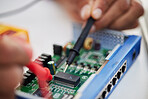 Motherboard, hands and technology with microchip, engineering and repair closeup. IT, hardware and electrical employee working on maintenance, problem solving and circuit check of battery with tools