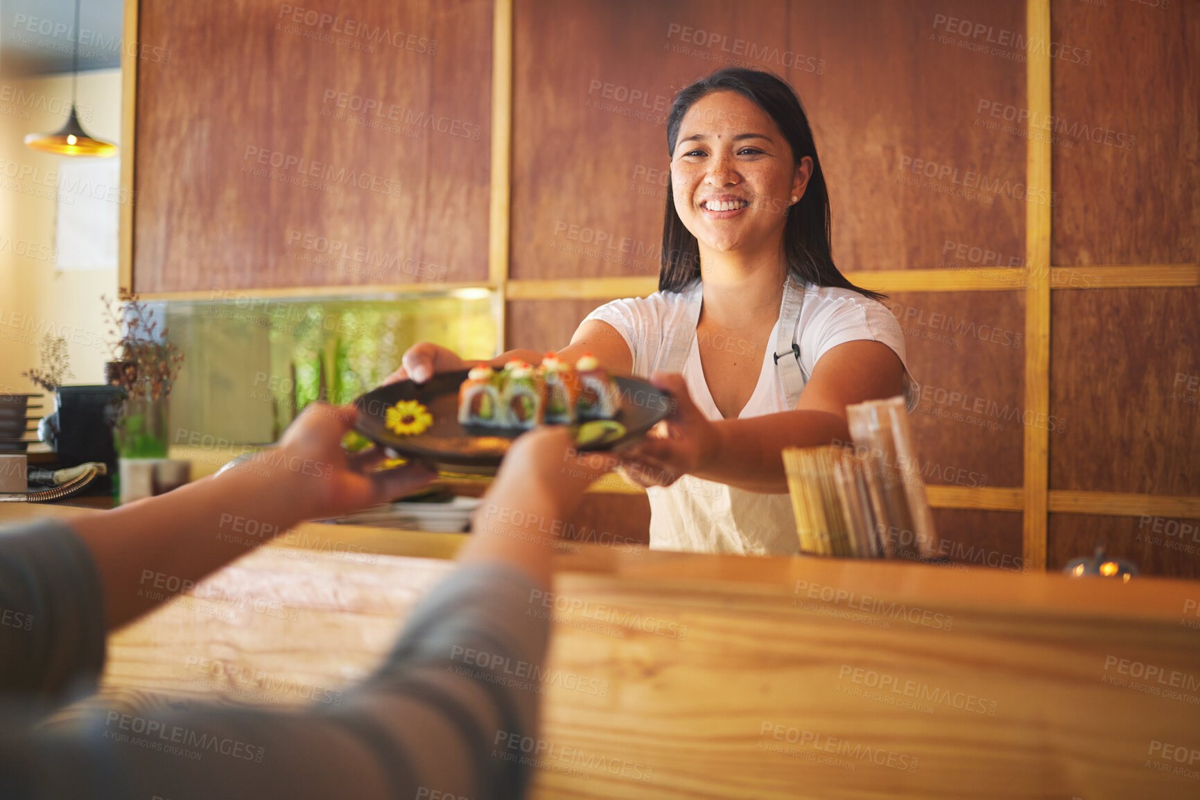 Buy stock photo Sushi chef, restaurant worker and woman with smile from food and Asian meal in a kitchen. Happy, female waiter or job working with fish menu for lunch order with cooking in Japanese bar with service