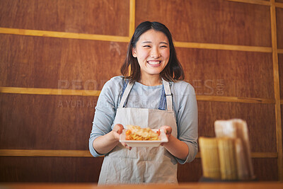 Buy stock photo Chinese food, waitress and an asian woman in a sushi kitchen to serve a traditional meal for nutrition. Restaurant, smile and cooking with a happy young employee in an eatery for fine dining cuisine