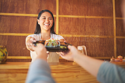 Buy stock photo Sushi, restaurant worker job and woman with smile from food and Asian meal in a kitchen. Happy, female waiter or chef working with salmon roll lunch order with cooking in Japanese bar with service