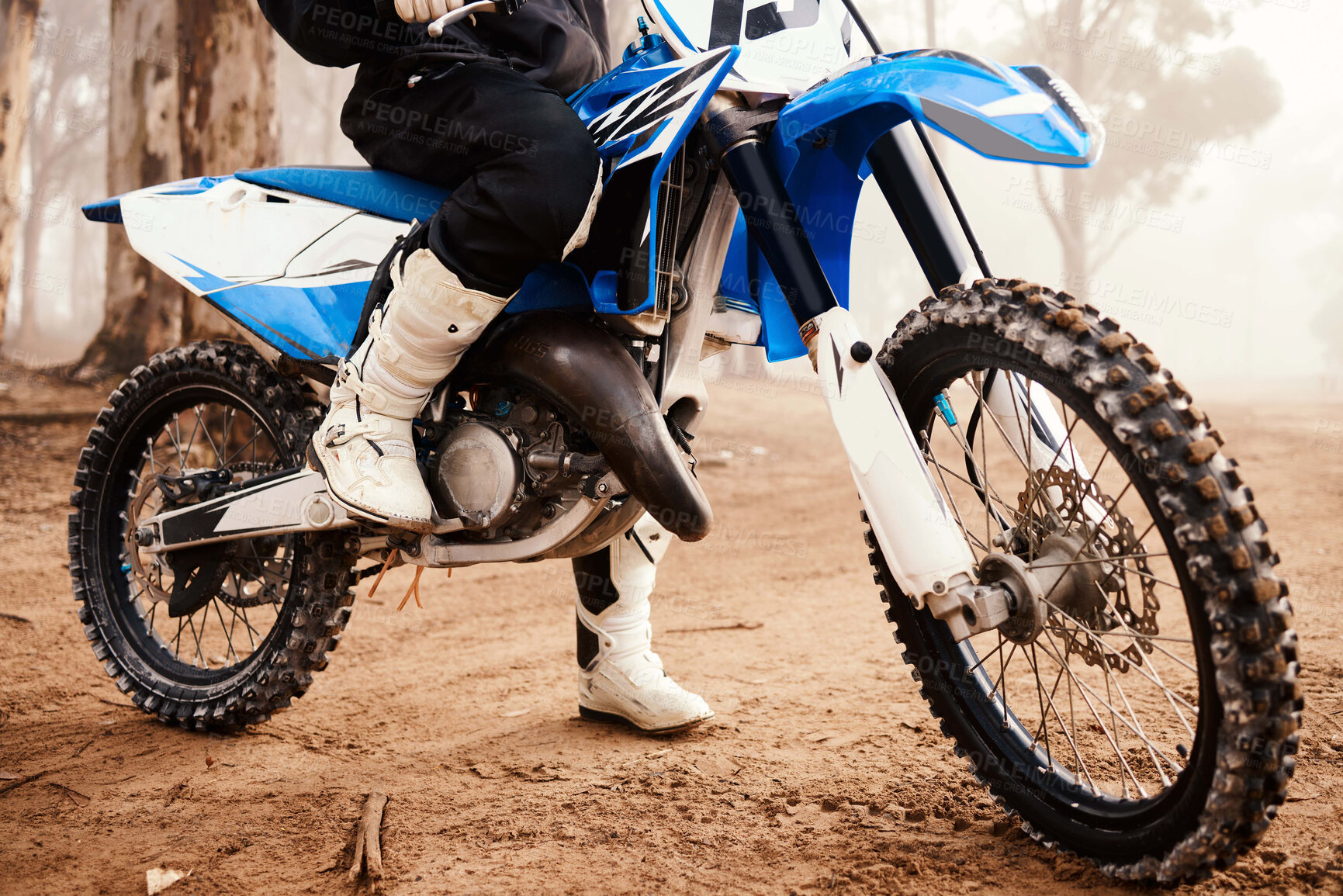 Buy stock photo Motorcycle, person legs and sports in forest with training for competition, nature with action and helmet. Extreme, adrenaline and exercise, athlete and transport with dirt bike, freedom and travel