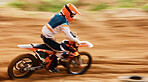 Motorcycle, sand and motion blur with a sports man on space in the desert for dirt biking. Bike, fitness and speed with a person driving on an off road course for freedom or performance closeup