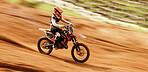 Bike, training and motion blur with a sports man on space in the desert for dirt biking. Motorcycle, fitness and power with a person driving at speed off road on sand for freedom or performance