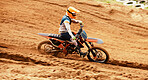 Motorcycle, dust and motion blur with a sports man on space in the desert for dirt biking. Bike, fitness and speed with a person driving on sand or off road course for freedom or performance