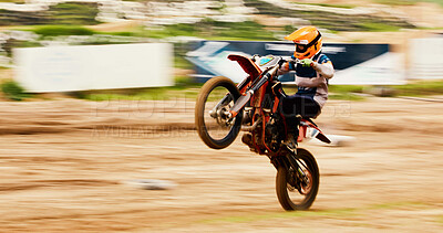 Buy stock photo Bike, balance and motion blur with a man on space at a race for a dirt biking challenge. Motorcycle, speed and power with a person driving fast on an off road course for freedom or performance