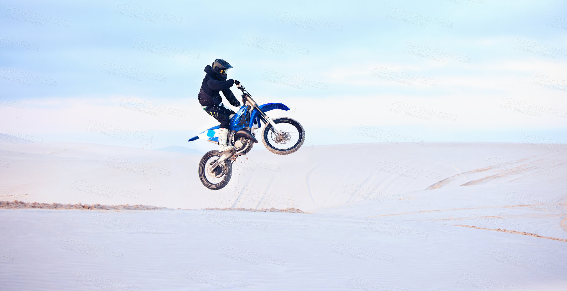 Buy stock photo Desert, jump or person driving motorcycle for action, adventure or fitness with performance or adrenaline. Sand, risk or sports athlete on motorbike on dunes for training, exercise or race challenge