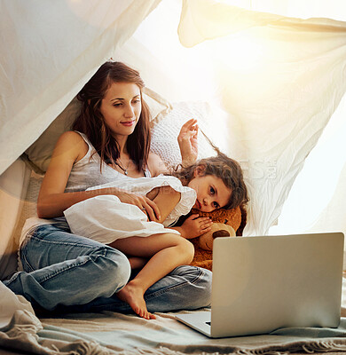 Buy stock photo Night, woman and child with laptop, tent and bonding with movies, comfort and love in home. Computer, mother and daughter together in fort in bedroom for online streaming subscription, film and relax