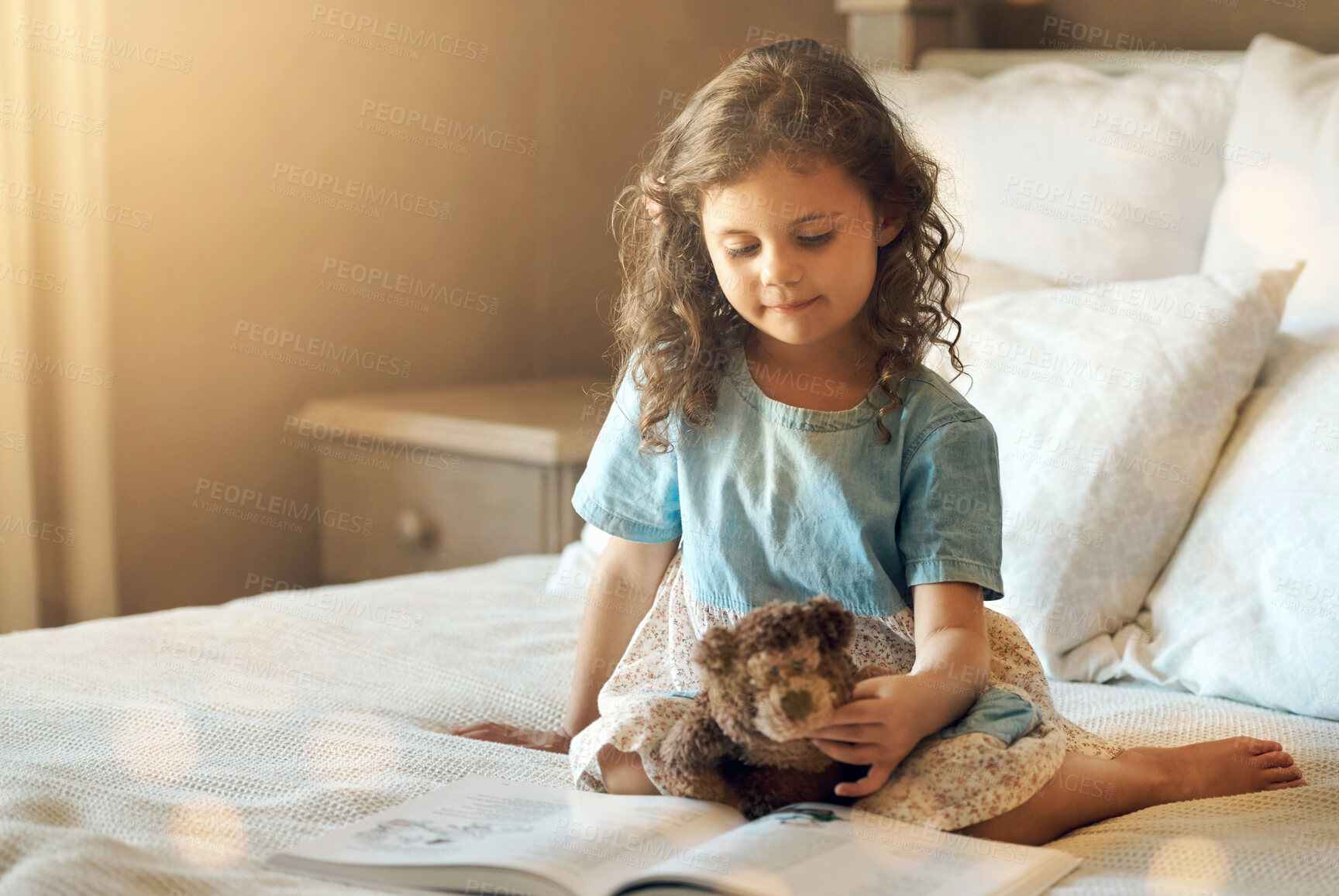 Buy stock photo Story, book and child reading on bed at home with learning, storytelling and teddy bear in the morning. Development, education and youth fairytale with language and literature in bedroom with girl