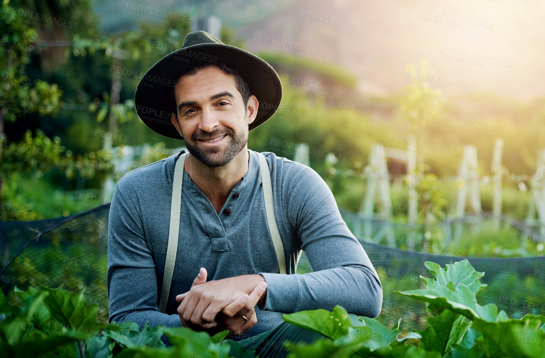 Buy stock photo Garden, man and portrait with agriculture, sustainability and eco farming work in the countryside. Smile, farmer and field with plants, vegetables and outdoor with gardening and food growth project