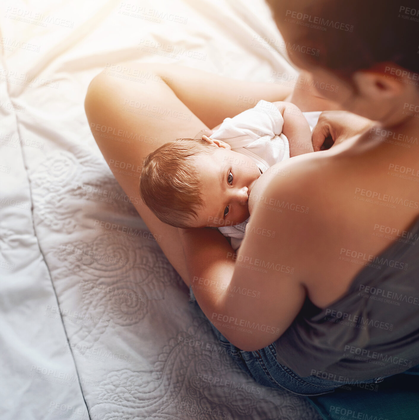 Buy stock photo Mom, boy baby and breastfeeding on bed for development growth, nutrition or digestive health in bedroom. Love, top view and woman with newborn child for natural milk, wellness or bonding in home