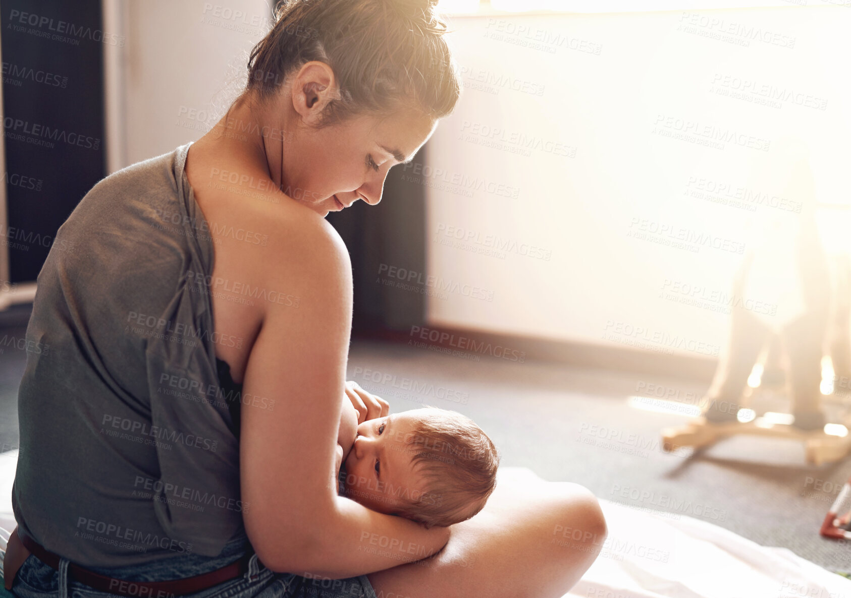 Buy stock photo Mother, baby and breastfeeding in bedroom for growth development, nutrition or digestive health. Lens flare, back and woman with newborn child for natural milk, wellness or bonding care in home