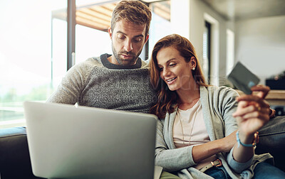 Buy stock photo Credit card, laptop and online shopping with couple on sofa in living room of home for payment or purchase. Computer, love or smile with happy man and woman in apartment together for ecommerce