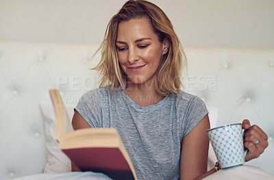 Buy stock photo Coffee, reading and woman with book in bed relaxing and drinking beverage on weekend morning at home. Smile, rest and person enjoying novel, story or literature with cappuccino in bedroom at house.