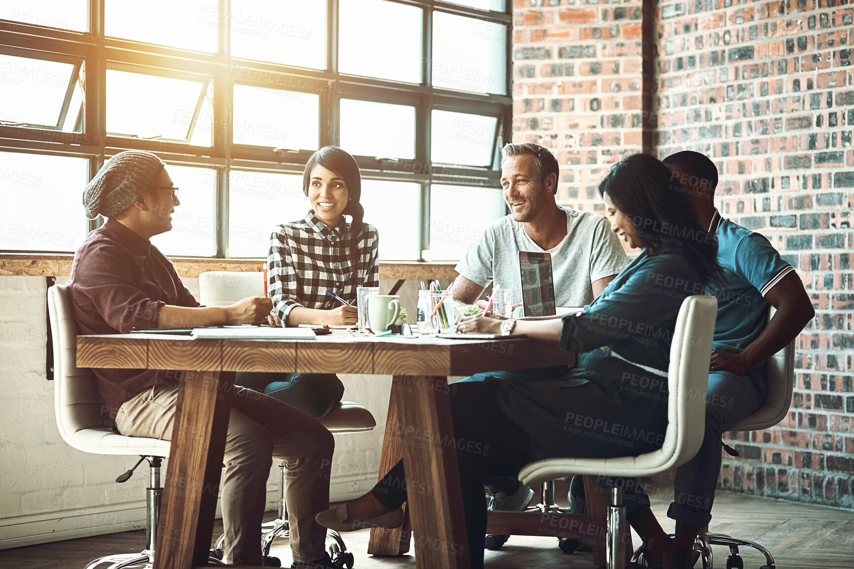 Buy stock photo Happy, people and business meeting for planning magazine, article and collaboration in office. Smile, copywriters and feedback with laptop and documents for blog research, discussion and teamwork