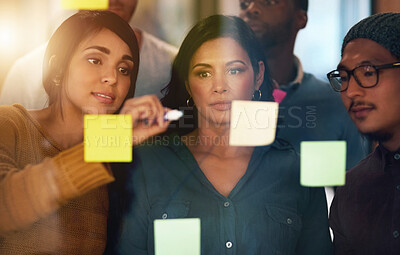 Buy stock photo Writing, meeting and business people with teamwork on glass board for idea, brainstorming or sticky notes in office. Project management, diversity and staff for collaboration, planning or workshop