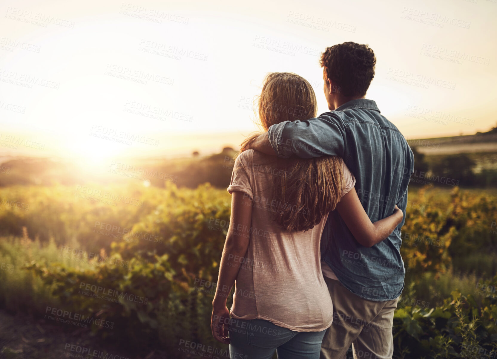 Buy stock photo Back, hug and couple in morning, peace and together in field , love and date for anniversary. Sunrise, partner and person with embrace, nature and countryside in grass and relax in Texas in farm