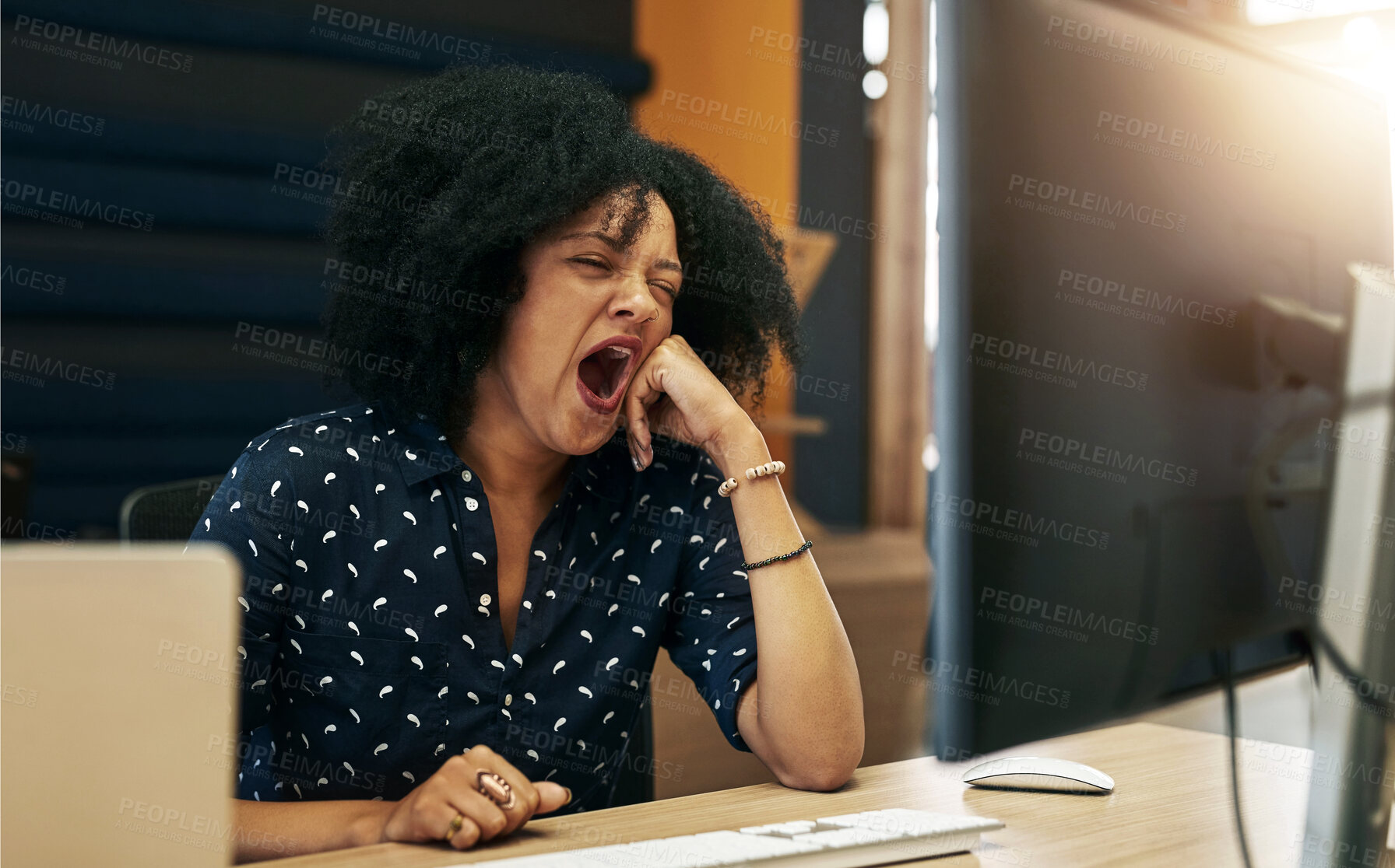 Buy stock photo Burnout, computer and tired with designer woman at desk in office for fatigue or project deadline. Night, sleepless and yawn with employee working late in evening at workplace for online report