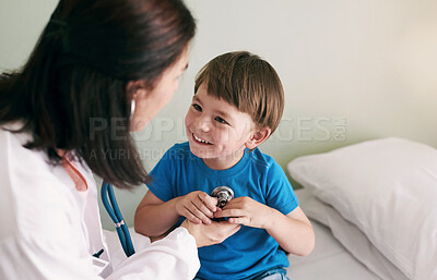 Buy stock photo Doctor, stethoscope and child in hospital for healthcare, health and wellness with medical exam. Female pediatrician, assessment and patient in clinic for heart, lungs and cardiology with breathing