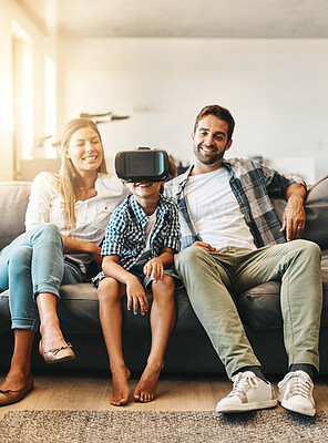 Buy stock photo Virtual reality, family and boy child on sofa with headset for futuristic, digital interaction or learning in home. Parents, metaverse and young kid for simulation, curiosity or education video game