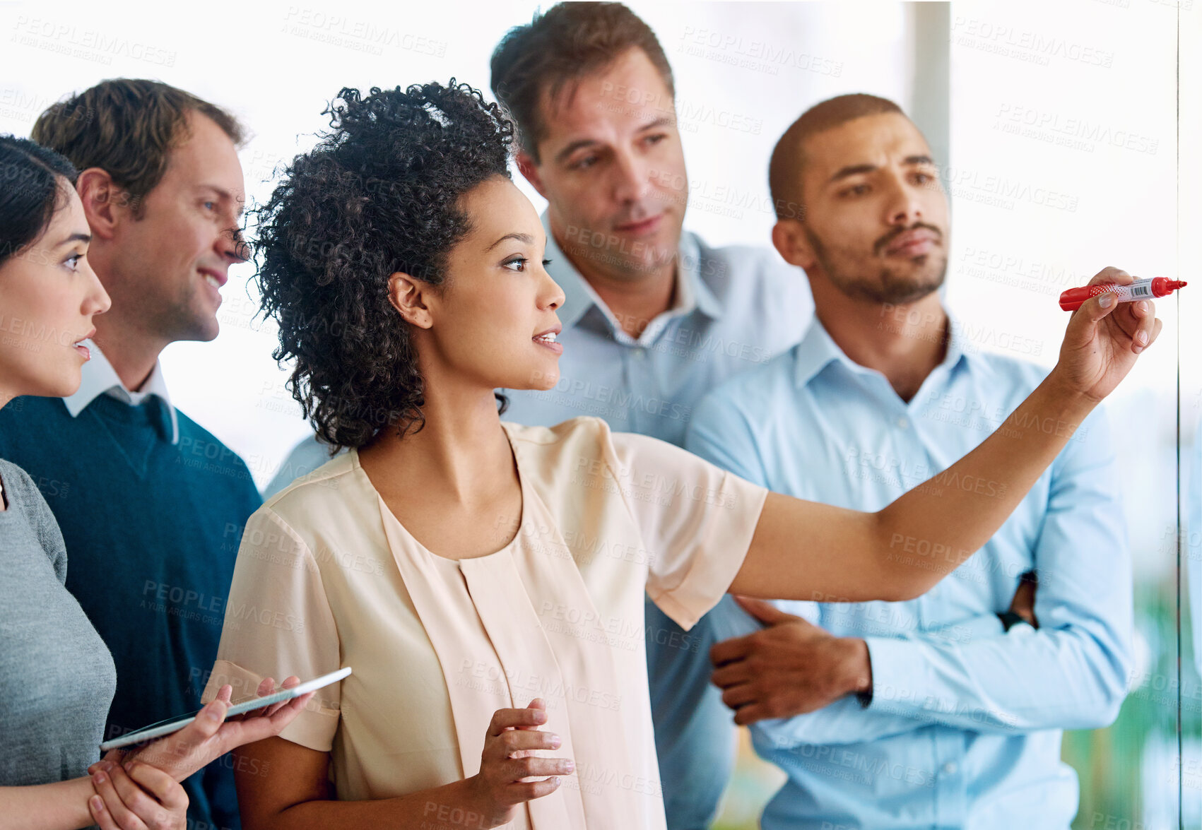 Buy stock photo Business people, writing and coaching with tablet for planning, tasks or agenda on glass board at office. Group of young and creative employees taking notes for discussion, brainstorming or startup