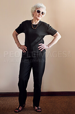 Buy stock photo Fashion, sunglasses and senior woman with pride on wall background for stylish, cool and unique fun aesthetic. Retirement, trendy with attitude and elderly female model with designer grandma glasses