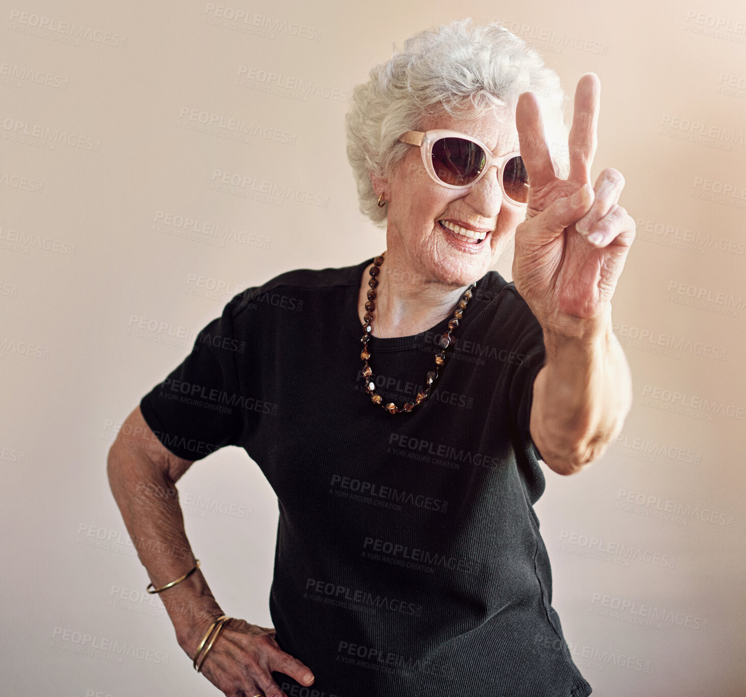 Buy stock photo Senior, woman and fashion with peace sign by wall background of trendy sunglasses, stylish or cool aesthetic. Fun, female person and retirement with hand gesture, unique and designer eyewear