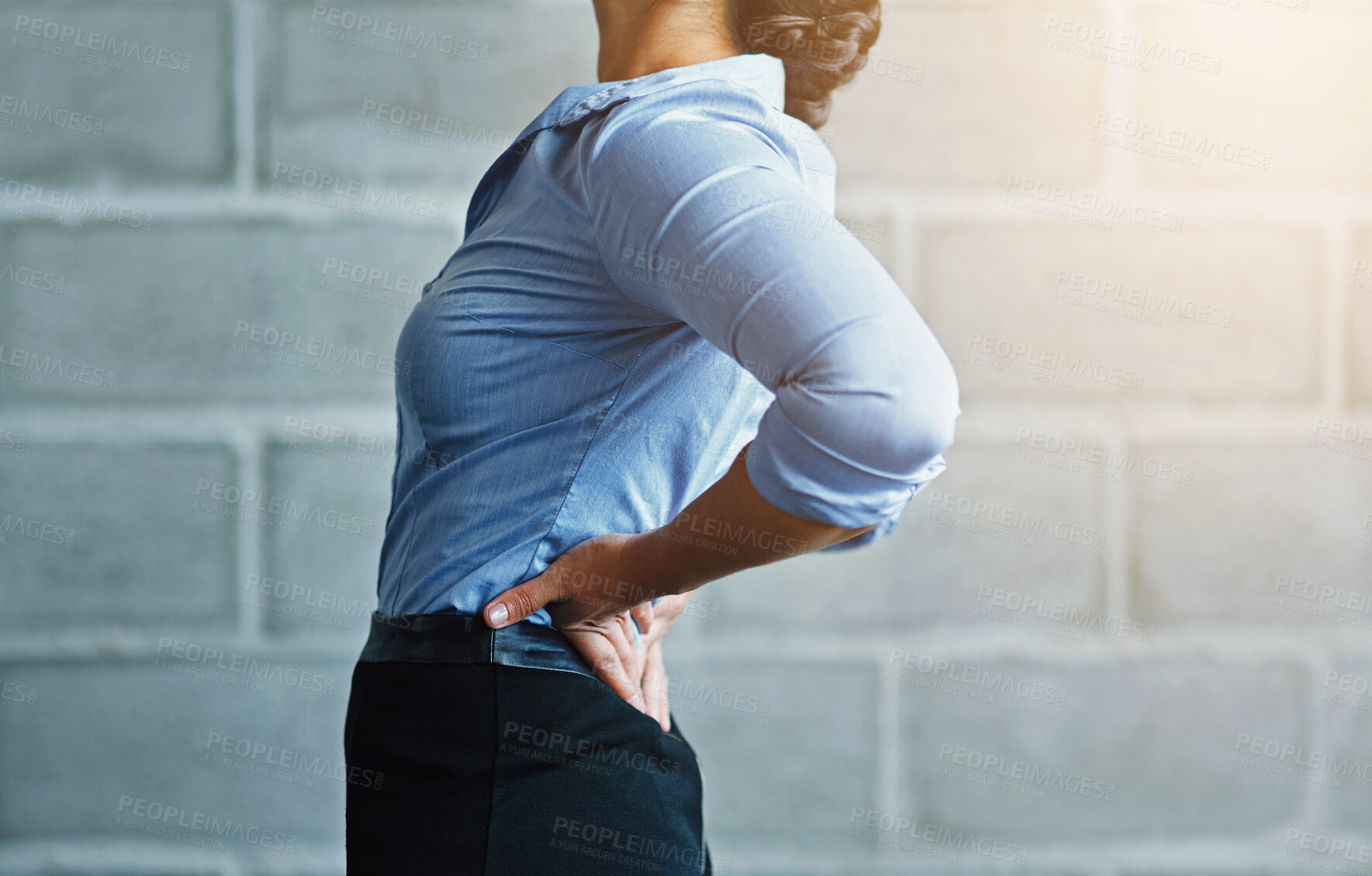 Buy stock photo Business, woman and sore with back pain by brick wall for muscle tension, fatigue and work injury. Corporate, professional and female person with problem in health for strain, stress or ache in spine