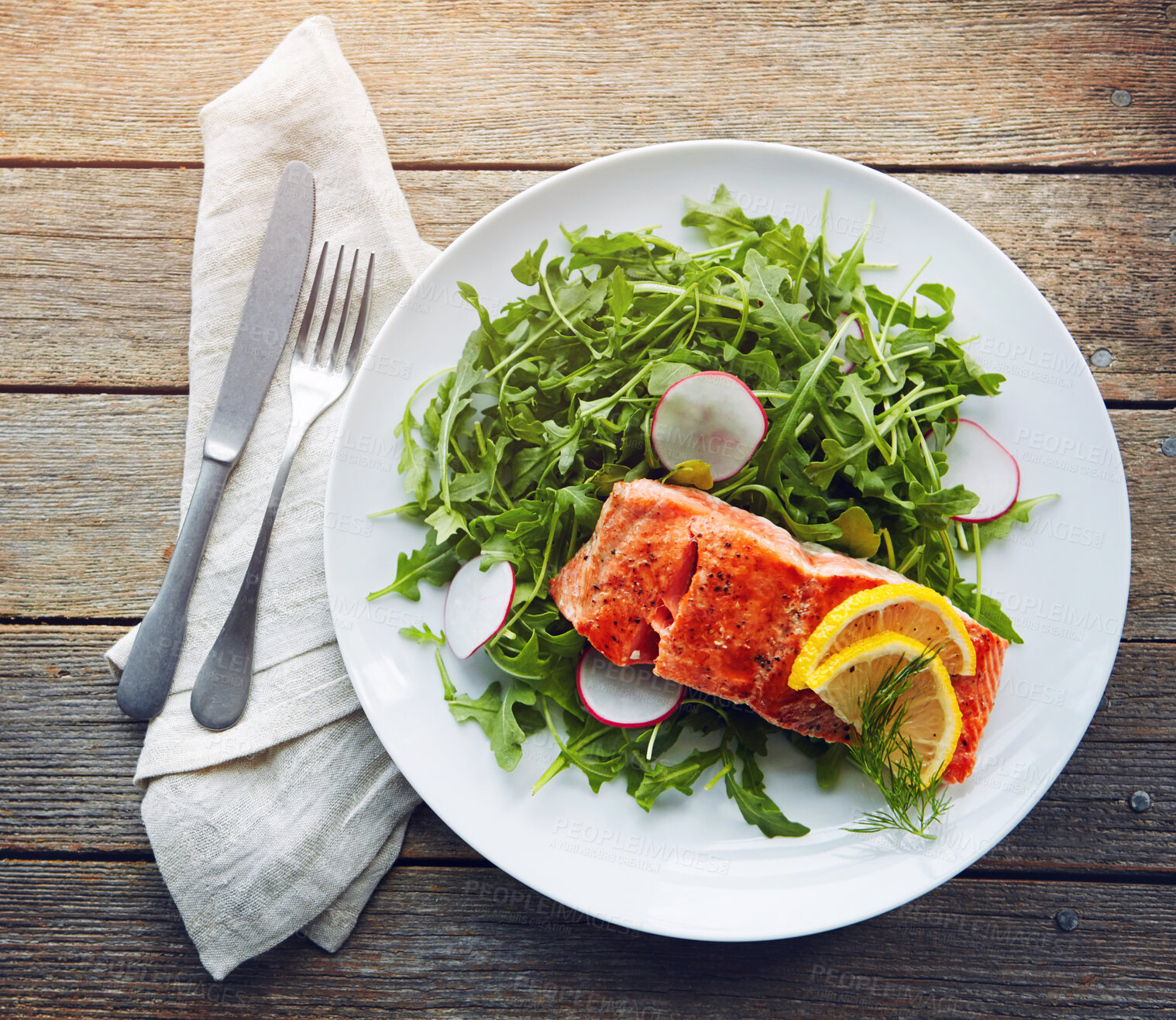 Buy stock photo Food, fish and healthy salad with nutrition for sinner, lunch plate and lose weight with pescatarian diet. Salmon, rocket and plant leaves or herbs for digestion with fine dining on wood background